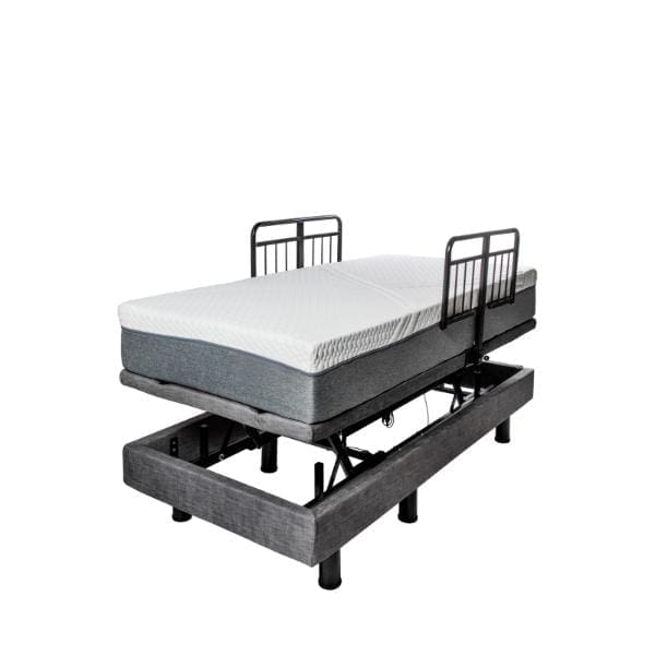 The Passport Hi Low Adjustable Bed, shown with a mattress, features side metal rails and is set in a partially inclined position. This bed frame, with multiple legs for support, flaunts a sleek gray fabric finish.