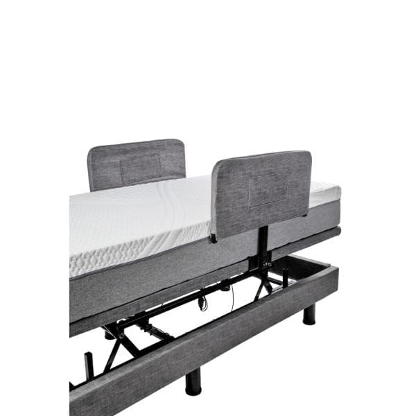 The Passport Hi Low Adjustable Bed features a gray fabric headboard and footboard, a white mattress on a metal frame, and an innovative base mechanism for easy adjustment of mattress positions to ensure personalized comfort.