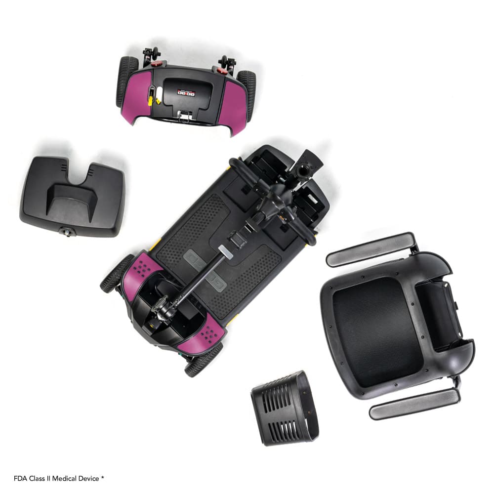 Disassembled black and purple GoGo Elite Traveller 2 parts, including the base, seat, battery, and tiller by Pride Mobility are arranged on a white background.