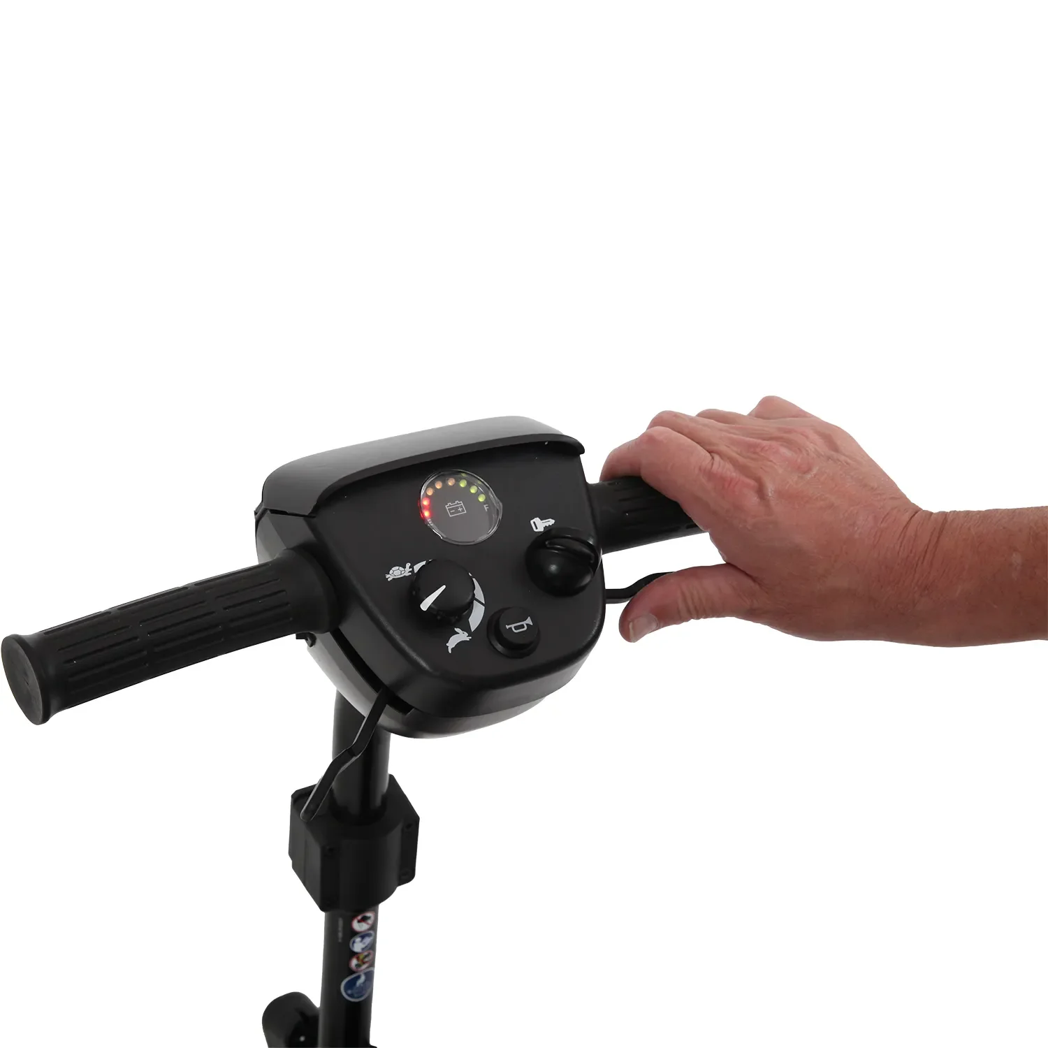 A persons hand gripping the handlebar of the Journey Adventure Scooter, with focus on the control panel featuring a speed dial and buttons.