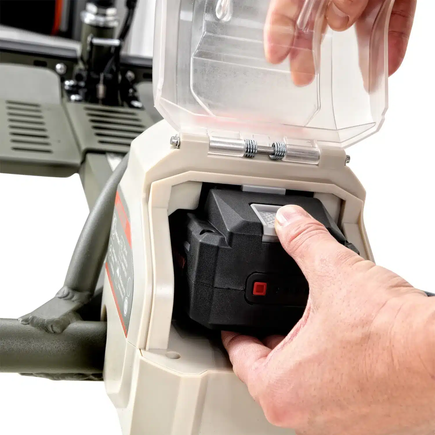 A person is inserting a rechargeable battery into the electric lawn mowers compartment, similar to the efficient design of the SuperHandy Passport Pro Scooter, with a clear plastic cover showcasing part of the control panel and handle, reflecting its modern functionality.