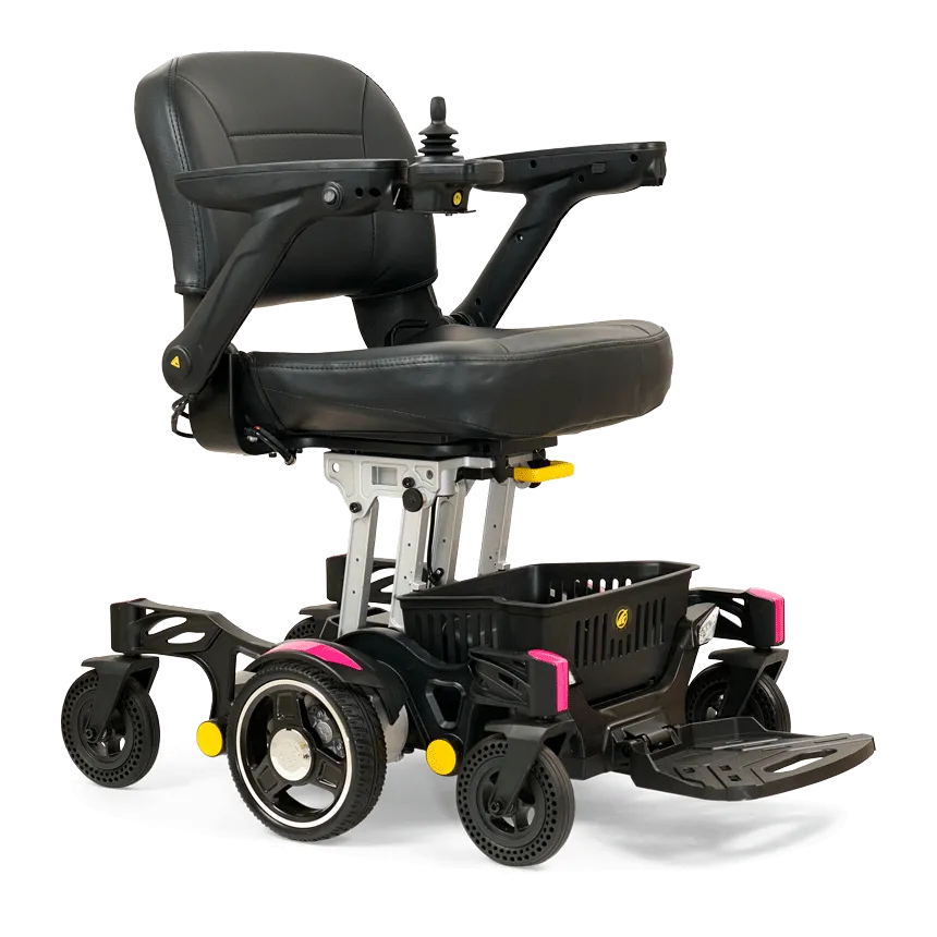 The Buzzaround Carry On Powerchair is a black and silver electric wheelchair featuring a cushioned seat, armrests, joystick control, four wheels, a footrest, and an under-seat storage basket for superior mobility assistance.